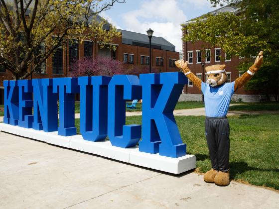 UK Mascot standing in front of "Kentucky" sign on UK One Day. 