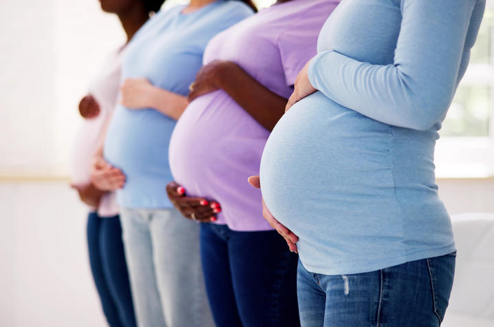Four Women holding their baby bump.
