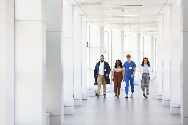 People walking through medical facility