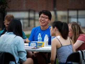 International student smiling while attending UKIC picnic