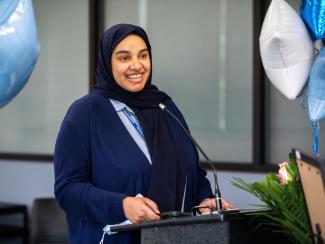 Student Talking at Microphone at Event