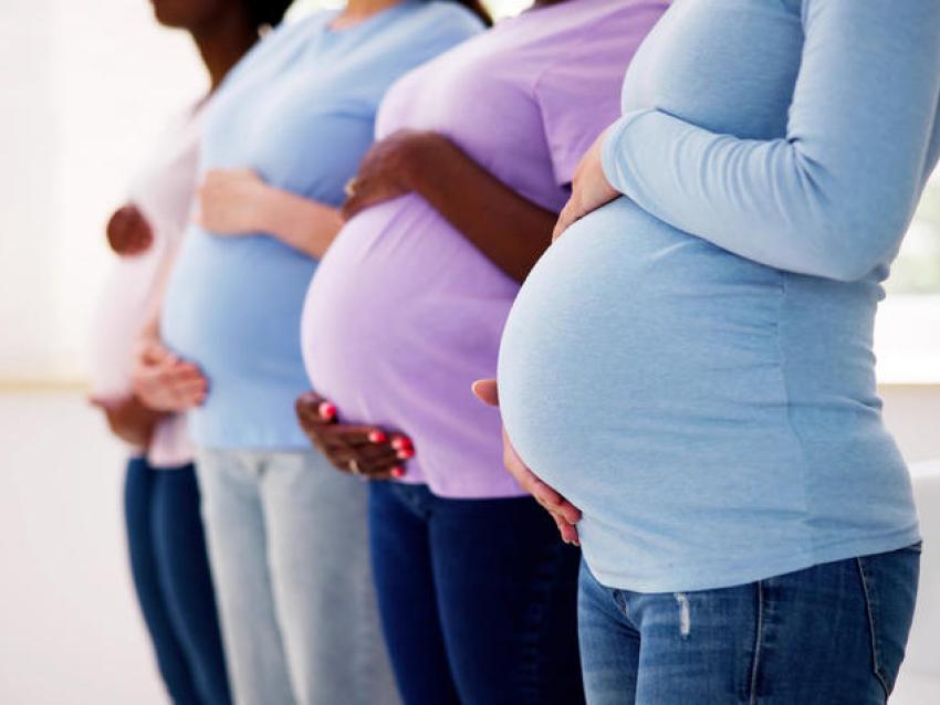 Four Women holding their baby bump.