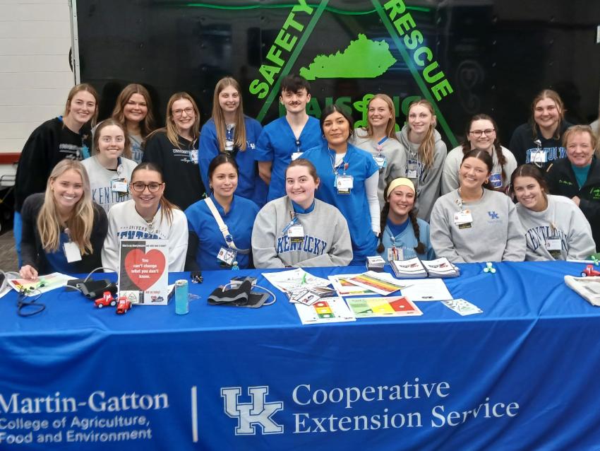 Group of students standing together and smiling for a photo