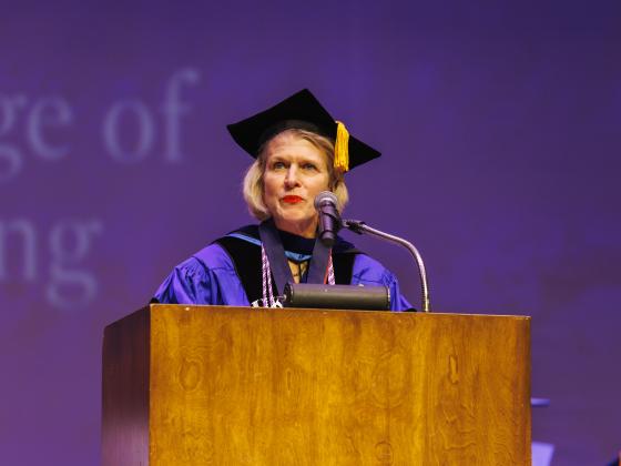 Dr. Mainous pictured speaking at commencement