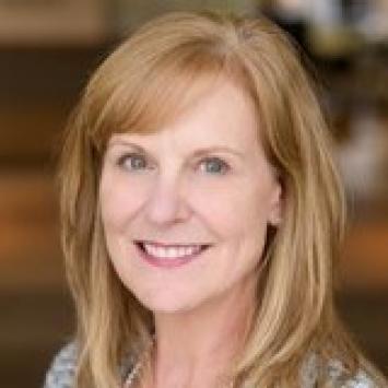 A headshot photo of Gwen Moreland smiling. 