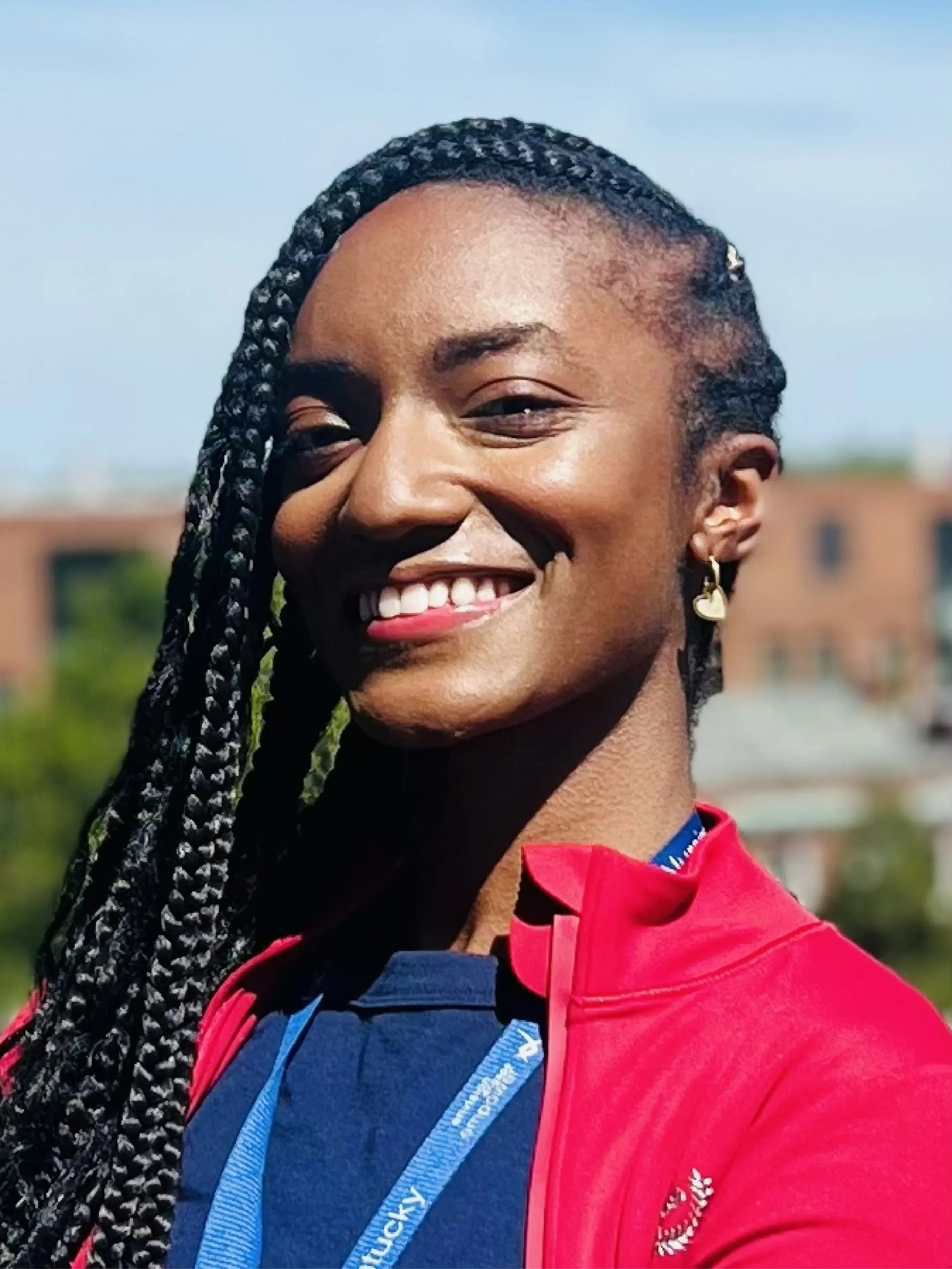 Headshot photo of Tatiyana Dean wearing red outside